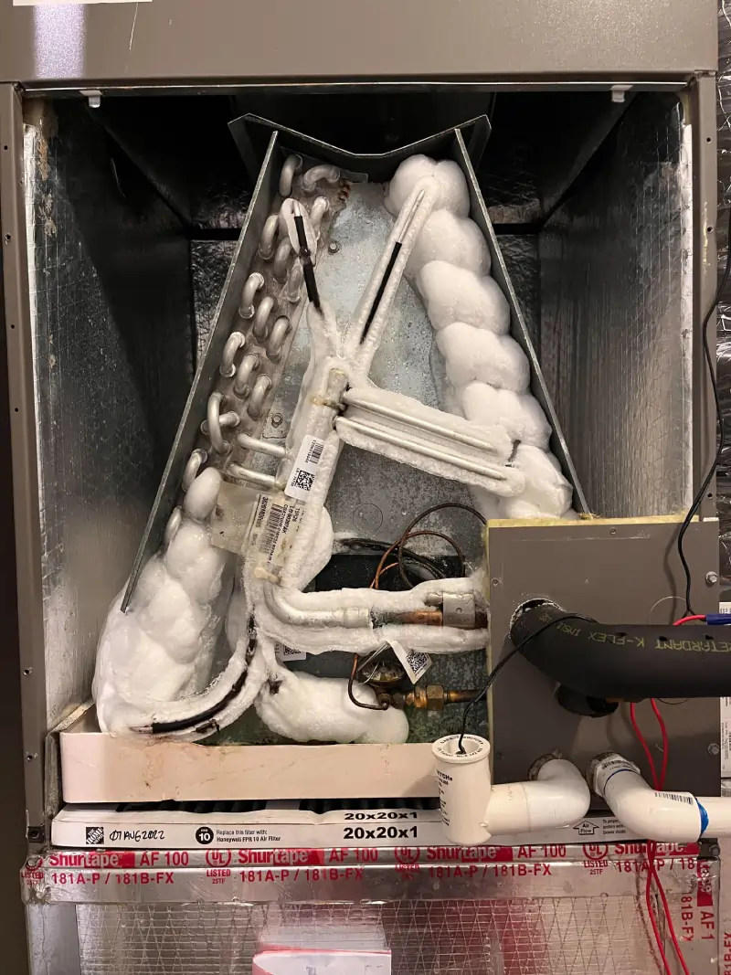 Frozen HVAC evaporator coil due to thermostat misuse during heatwave